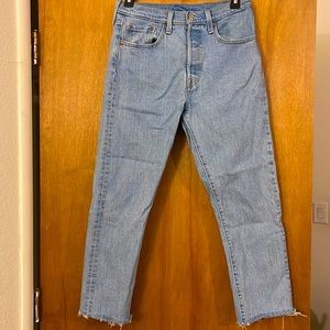 Vintage Women’s 501 Levis Light Blue Denim with button fly and raw hem bottoms